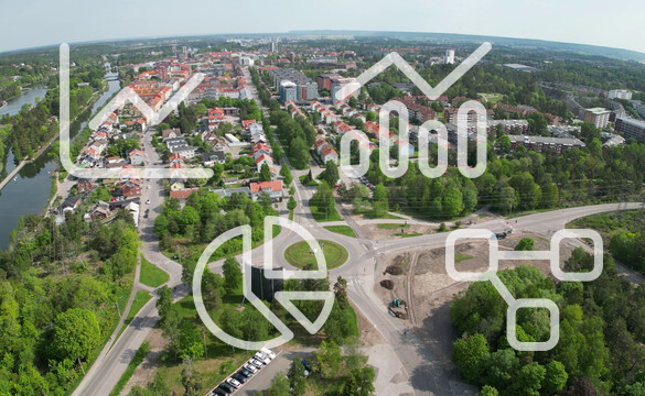Drönarbild över centrum och innovatum, ovanpå bilden ligger ikoner i form av olika diagram.