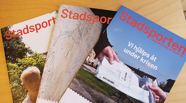 Bilden föreställer flera nummer av personaltidningen Stadsporten.