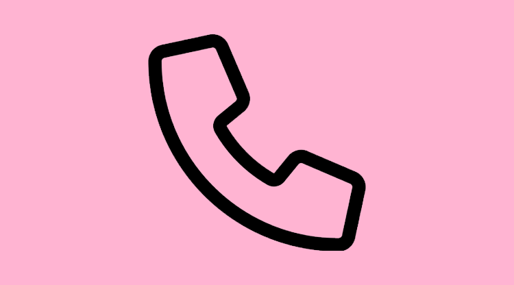 Telefon mot rosa bakgrund.