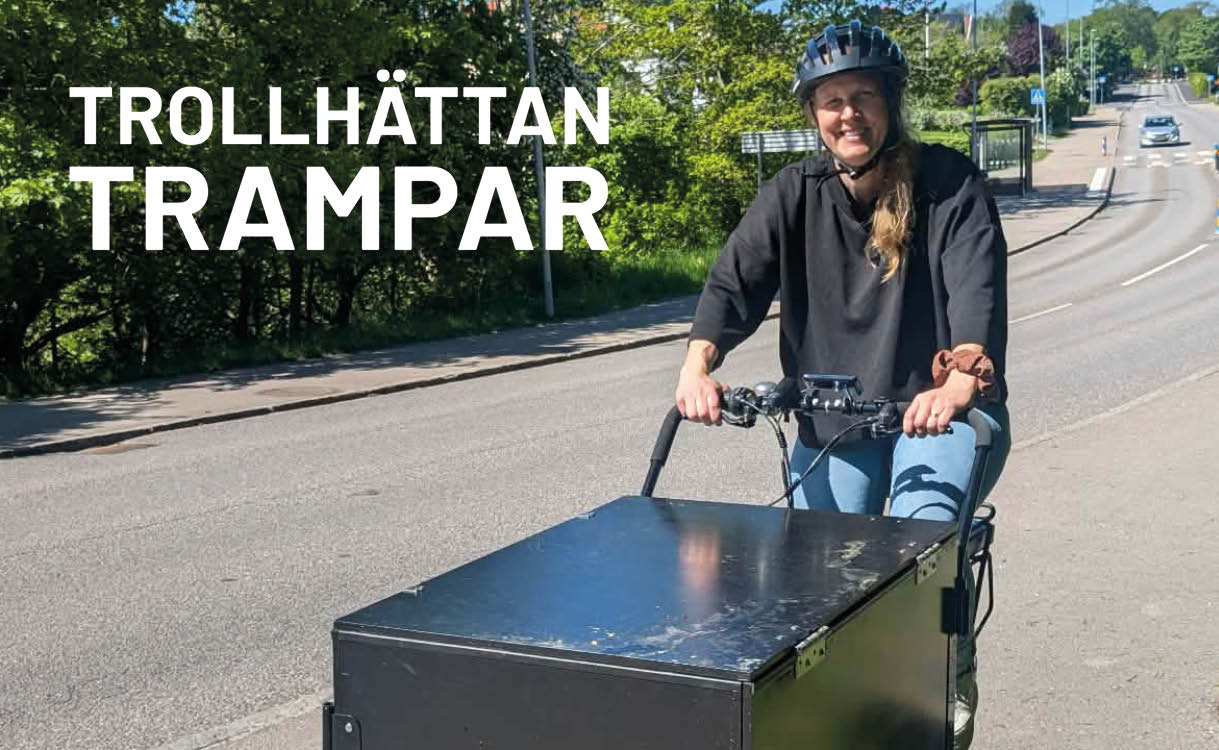 Kvinna på ellådcykel i trafiken. 