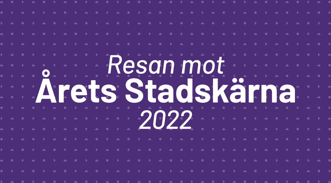 Lila bakgrund med texten "Årets stadskärna 2022"