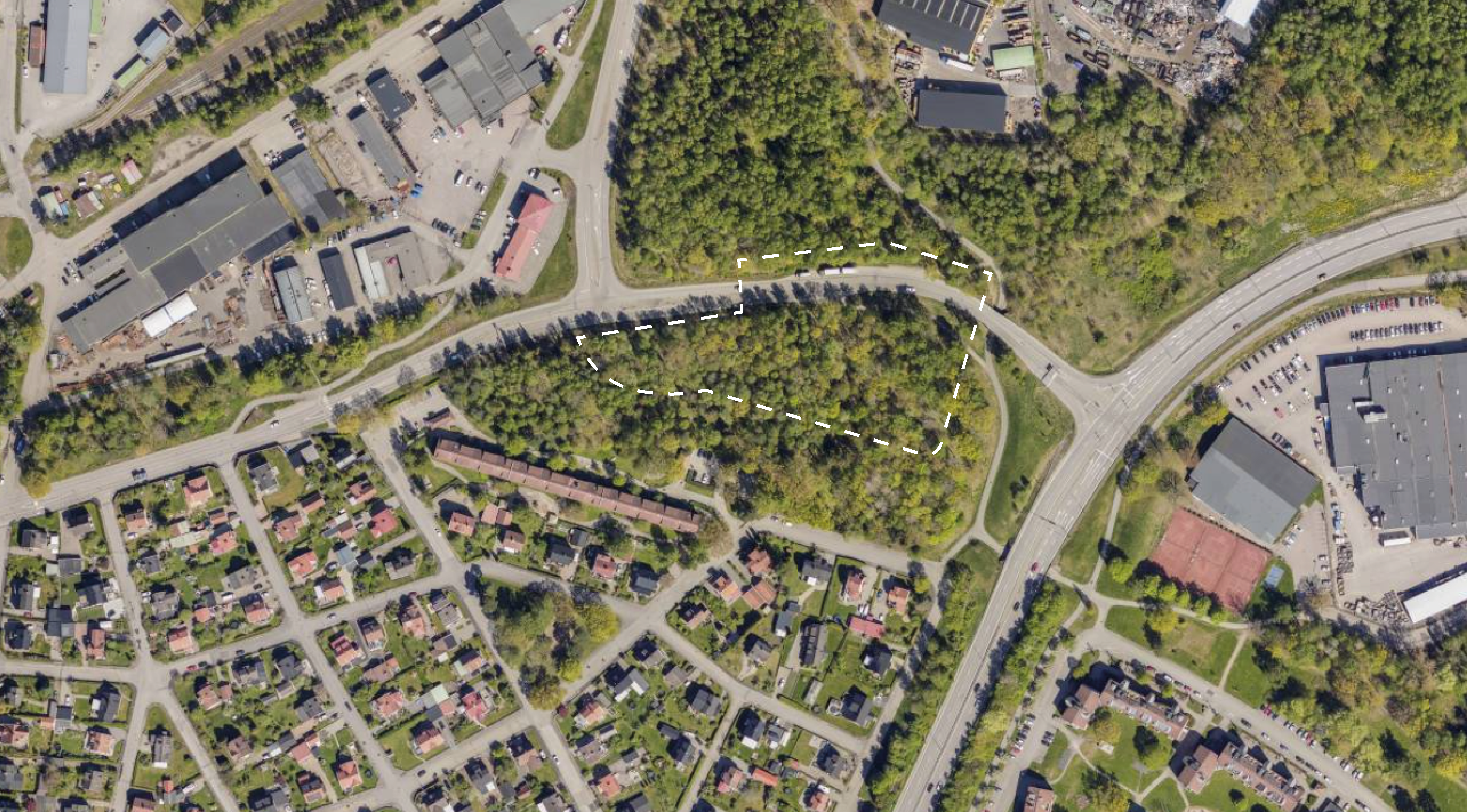 Flygfoto med planområdet markerat med vit streckad linje.