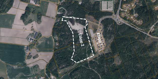 Flygfoto med planområdet markerat med vitstreckad linje.